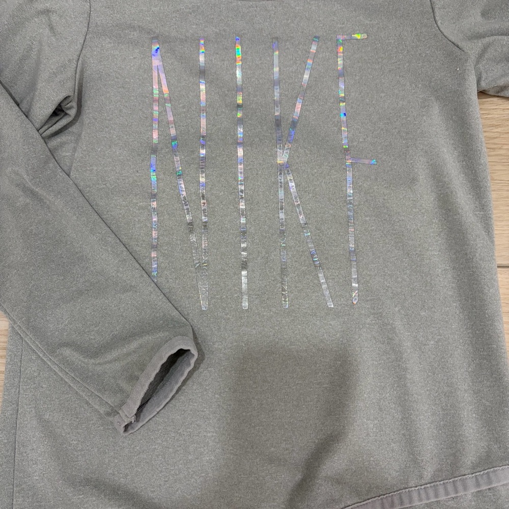 Nike Girls' Comfort Casual Gray Long Sleeve Dri-FIT Tee with Holographic Logo.
